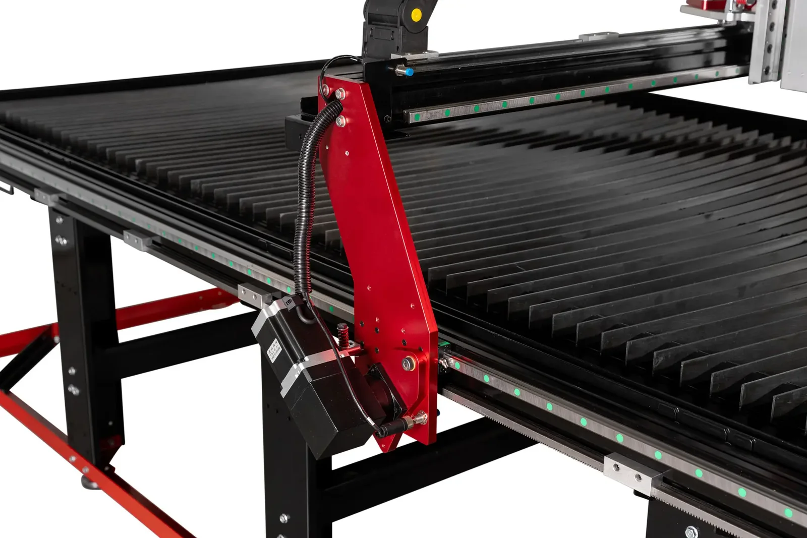 Red gantry riser and a drive motor at the side of the V3 table