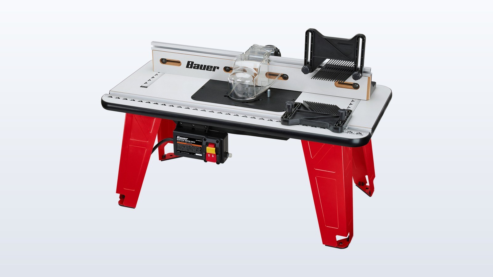 Red-legged BAUER benchtop router table with a router mounted underneath and a clear bit guard
