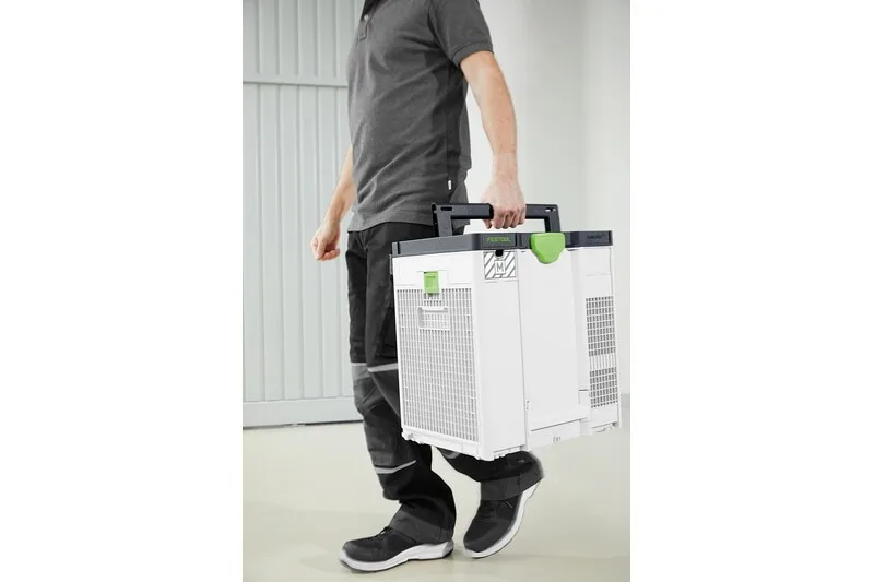A worker carrying the SYS-AIR in a Systainer stack