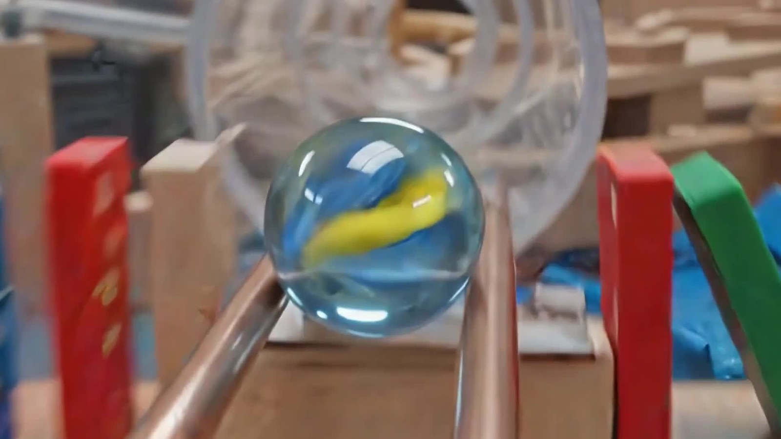 A still from Google's Omni launch showing a marble on a shop-style track