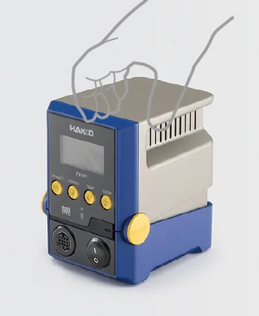 A Hakko FX-971 station with a hand showing how the display tilts