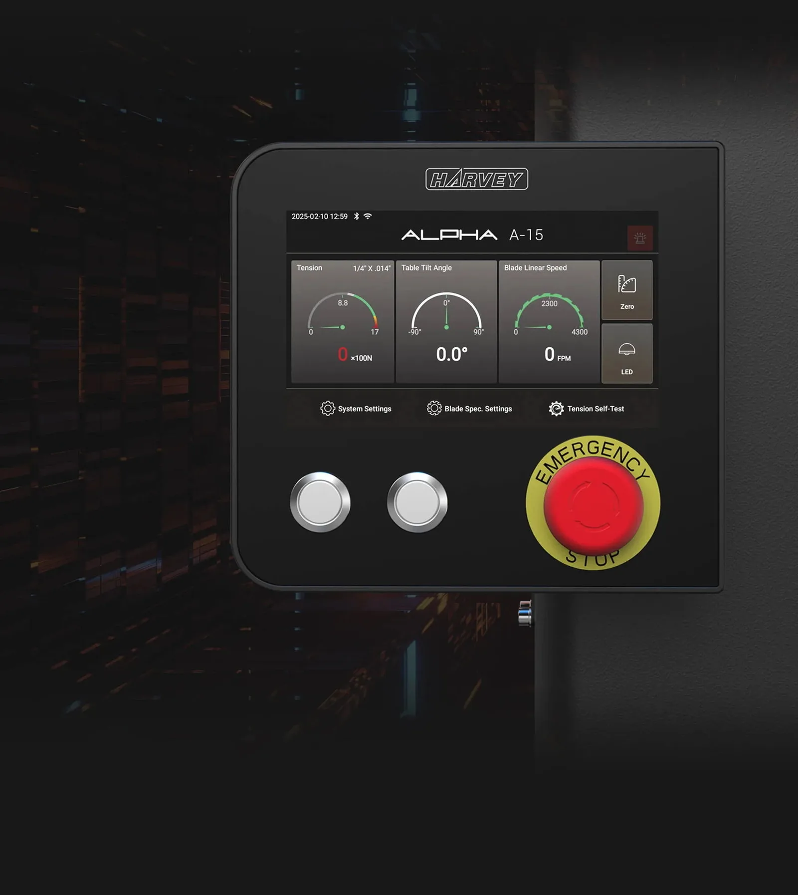 The Alpha A-15 touchscreen showing tension, tilt, and speed gauges beside an emergency stop button