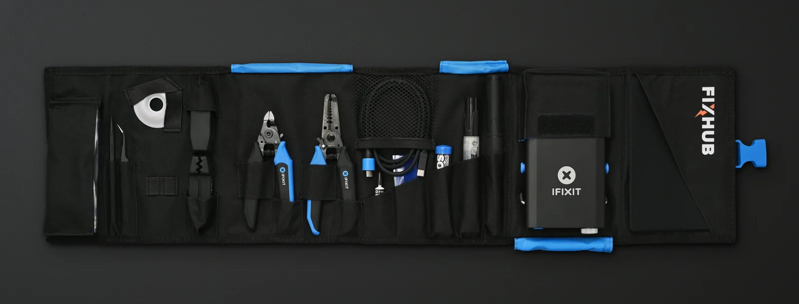 The FixHub soldering toolkit opened to show its tools and consumables