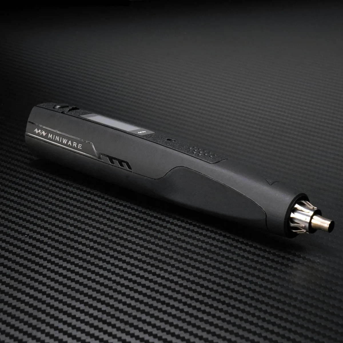 The AirGo 140 gun on a dark carbon-fiber surface