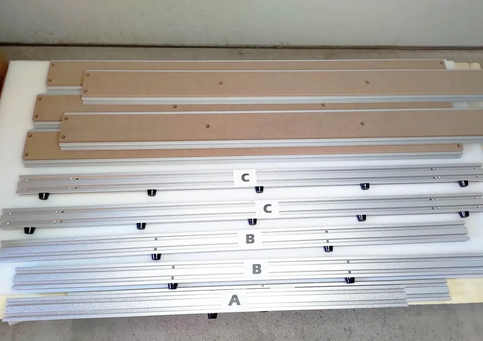 Aluminum extrusion pieces for the frame, labeled A, B, and C
