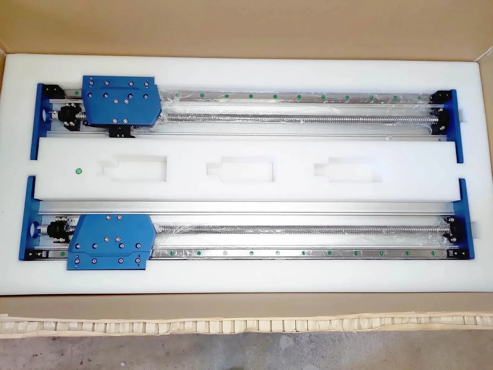 Pre-assembled Y-axis rail assemblies packed in white foam