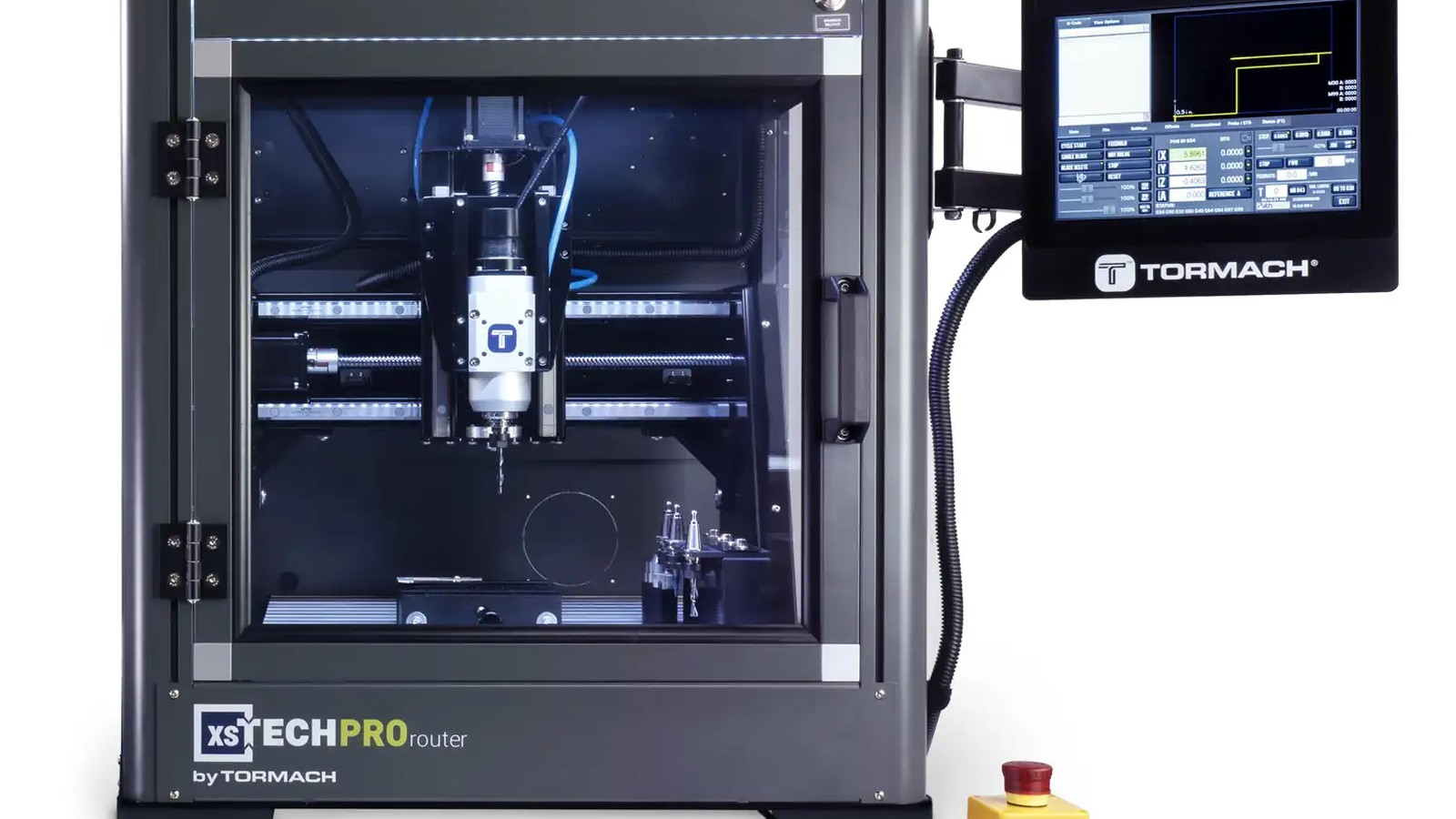 Tormach xsTECH Pro enclosed CNC router with a glass door, a spindle visible inside, and a touchscreen on an arm at the right