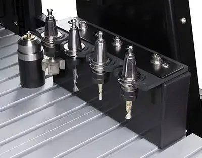 Tool holders and cutters lined up in the xsTECH Pro's tool changer rack