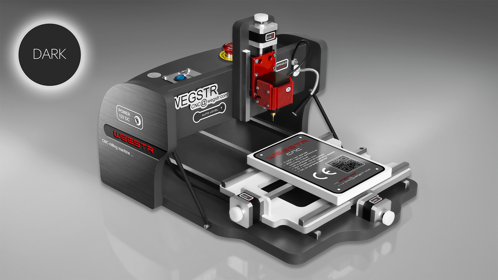 CNC Wegstr DARK desktop CNC mill in dark gray with a red spindle head and a small work plate on its sliding table