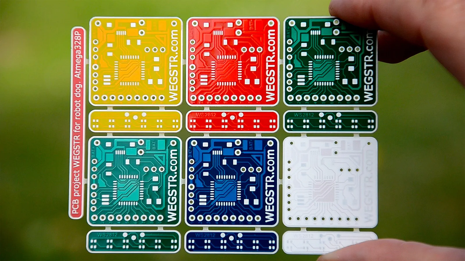Six blank circuit boards in different colors with WEGSTR printed on them