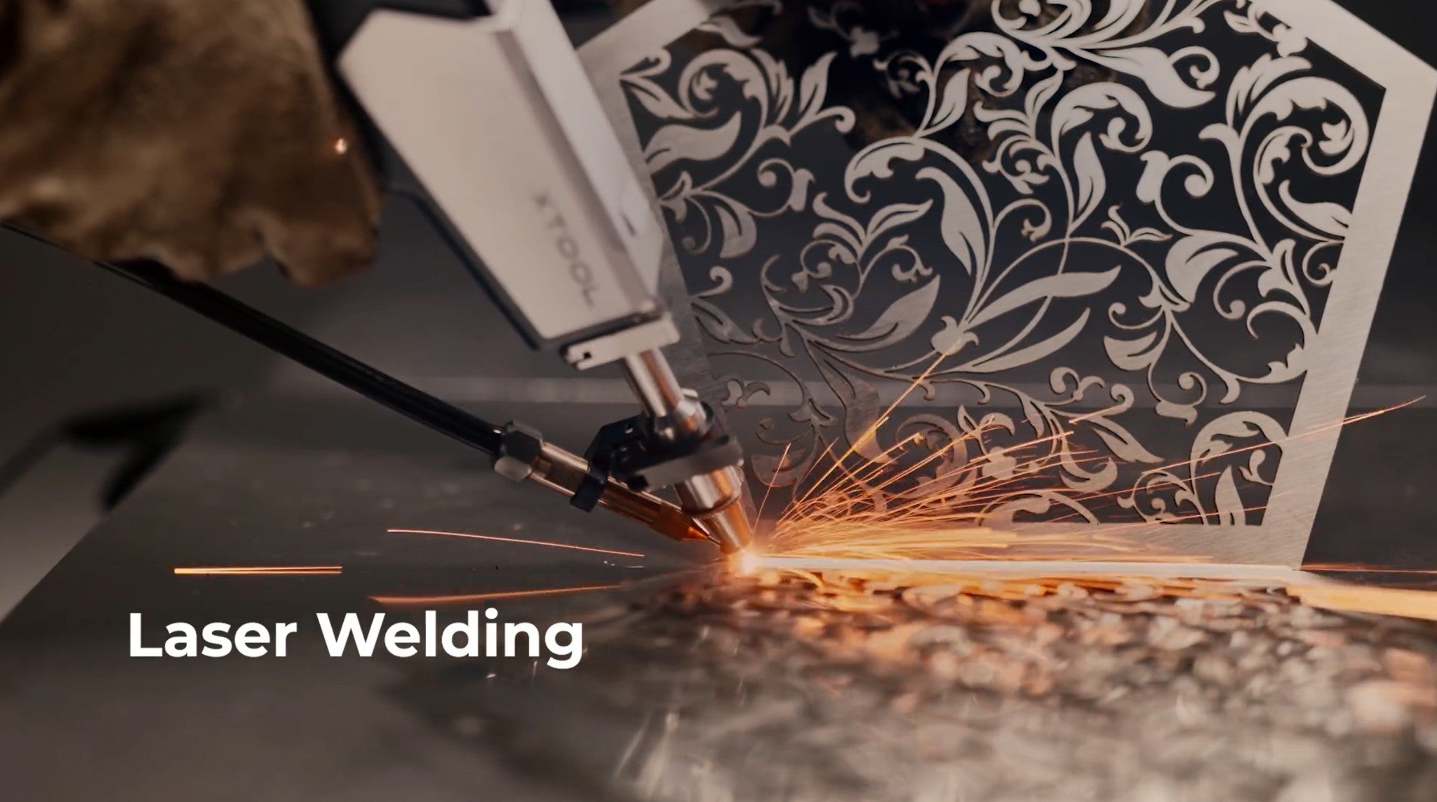 The xTool MetalFab handheld laser welding head joining sheet metal