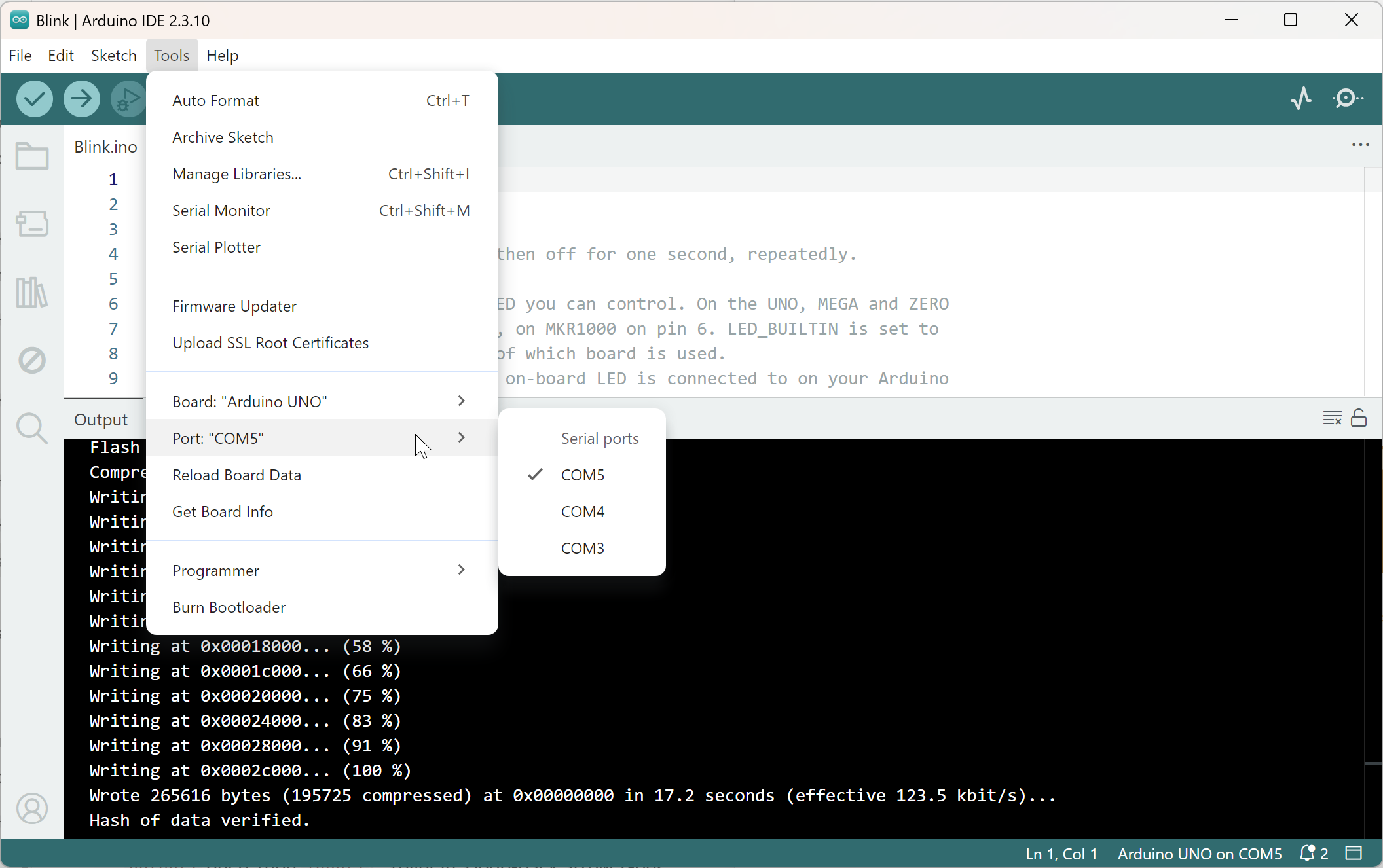 IDE 2's Tools menu with Port expanded, showing a real Arduino Uno detected on COM5 alongside the other available COM ports. The toolbar drop-down shows the same information in a more compact form.