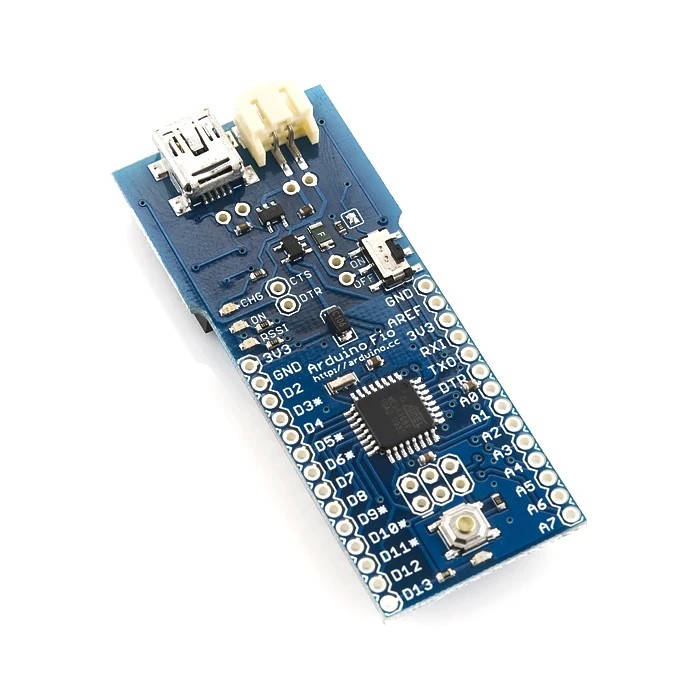 Photo of an Arduino Fio board, angled top view, showing the mini USB charging port, the battery connector, and the ATmega328P chip