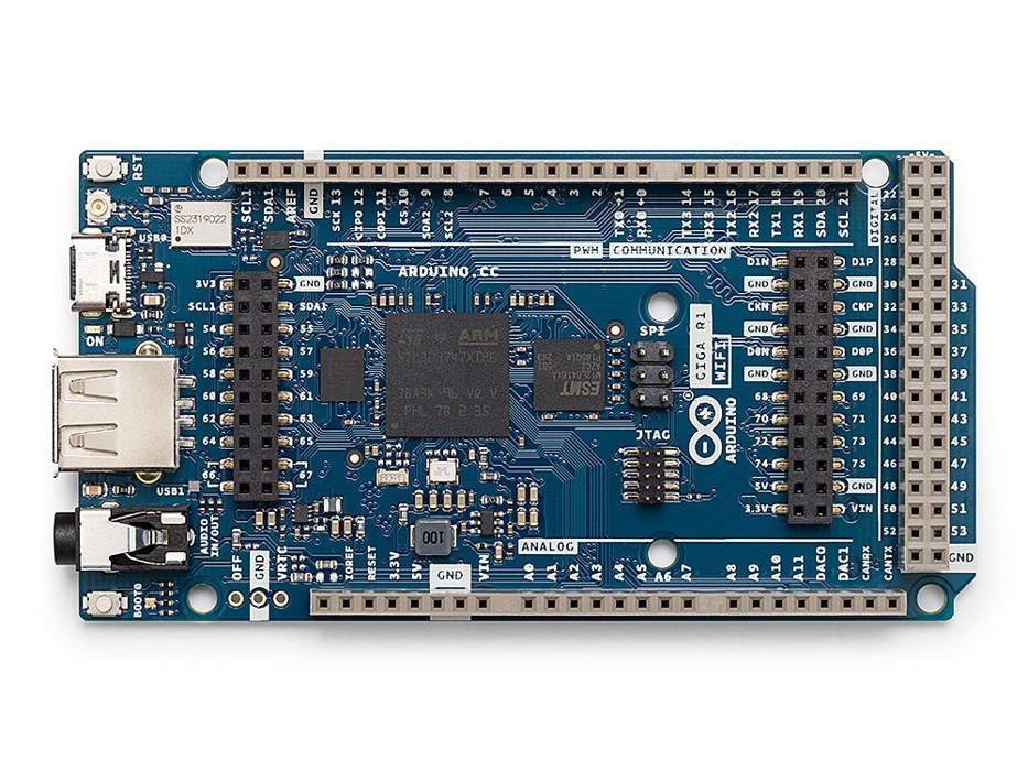 Photo of an Arduino GIGA R1 WiFi board, a large board with a USB-A port, an audio jack, and rows of pins
