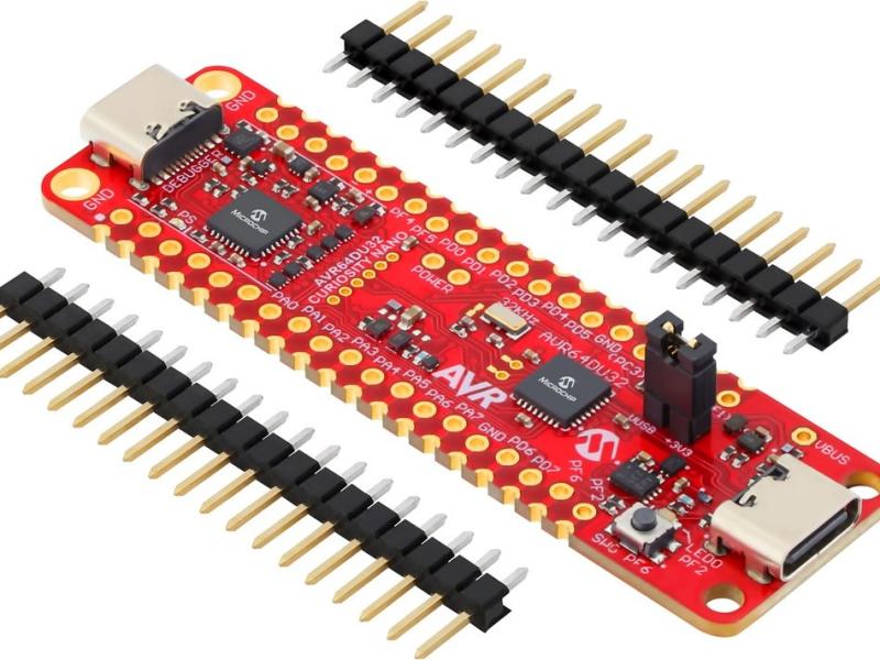 Microchip AVR64DU32 Curiosity Nano development board with loose header strips