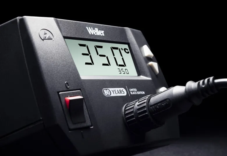 Close-up of the Weller WE1010 Black Edition display reading 350 degrees C beside the 80 years logo