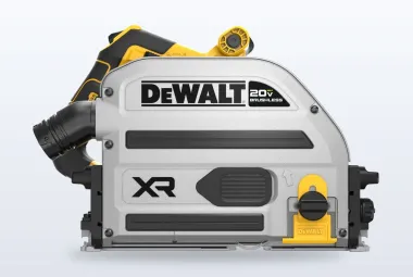 DeWalt 20V MAX XR plunge track saw on a guide rail cutting a sheet of plywood