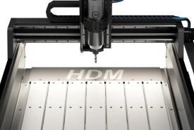 Shapeoko HDM V3 CNC router with its aluminum hybrid table, black gantry, and water-cooled spindle shown from the front