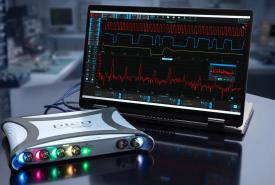 PicoScope 5000E USB oscilloscope with colored channel lights beside a laptop running PicoScope 7