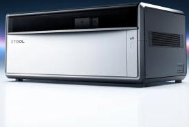 xTool X1 laser machine on a reflective white surface