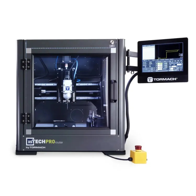 Tormach xsTECH Pro enclosed CNC router with a glass door, a spindle visible inside, and a touchscreen on an arm at the right