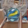 A still from Google's Omni launch showing a marble on a shop-style track