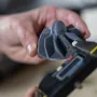 Hands holding a Prusa CORE One printhead part