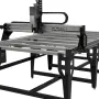 Sienci AltMill 4x8 CNC router rendered on a white background, a black steel frame supporting a long aluminum table with the gantry at one end