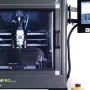 Tormach xsTECH Pro enclosed CNC router with a glass door, a spindle visible inside, and a touchscreen on an arm at the right
