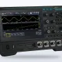 UNI-T MSO1000HD oscilloscope with a 7-inch touch screen showing waveforms