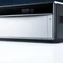 xTool X1 laser machine on a reflective white surface